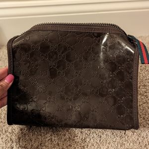 Gucci cosmetic bag embossed G